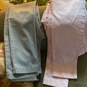 Two pairs of men’s chino pants one gray and one pink.Worn only one or two times